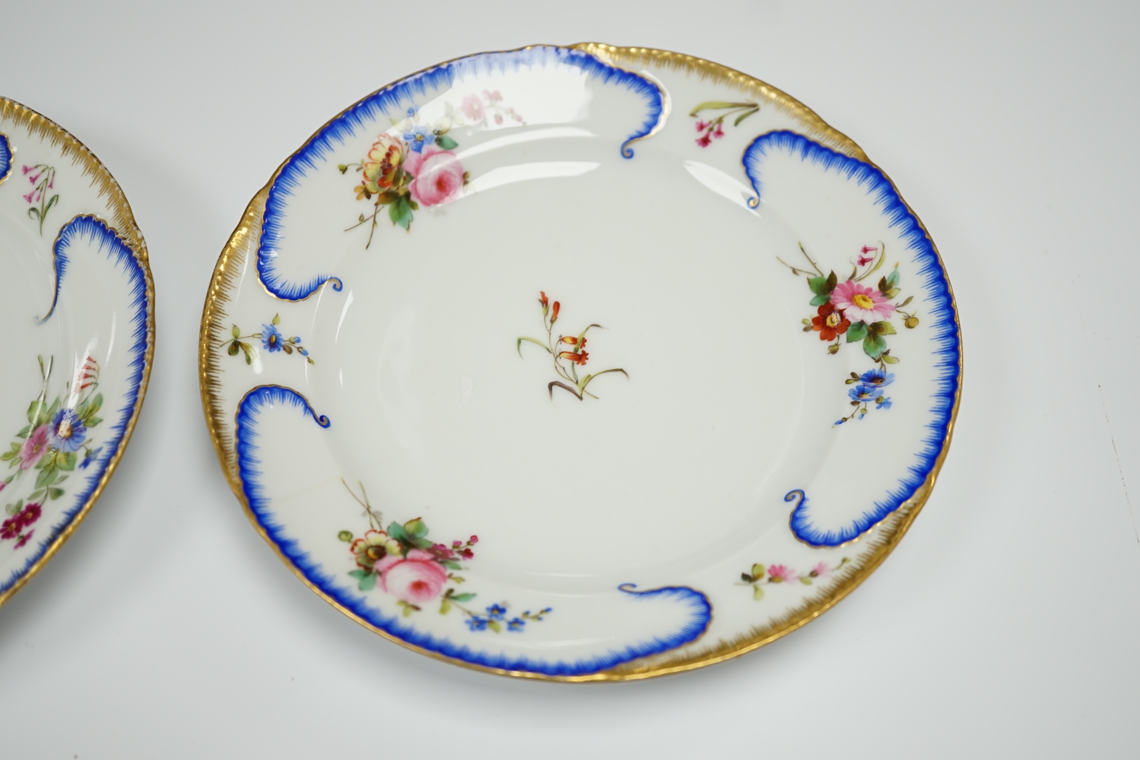A pair of Alexander II Russian Imperial porcelain ‘Peterhof-Palast’ floral rim plates, 19cm (a.f.)